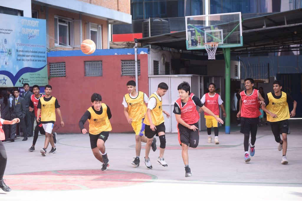 Uniglobe SS- Students running for the ball