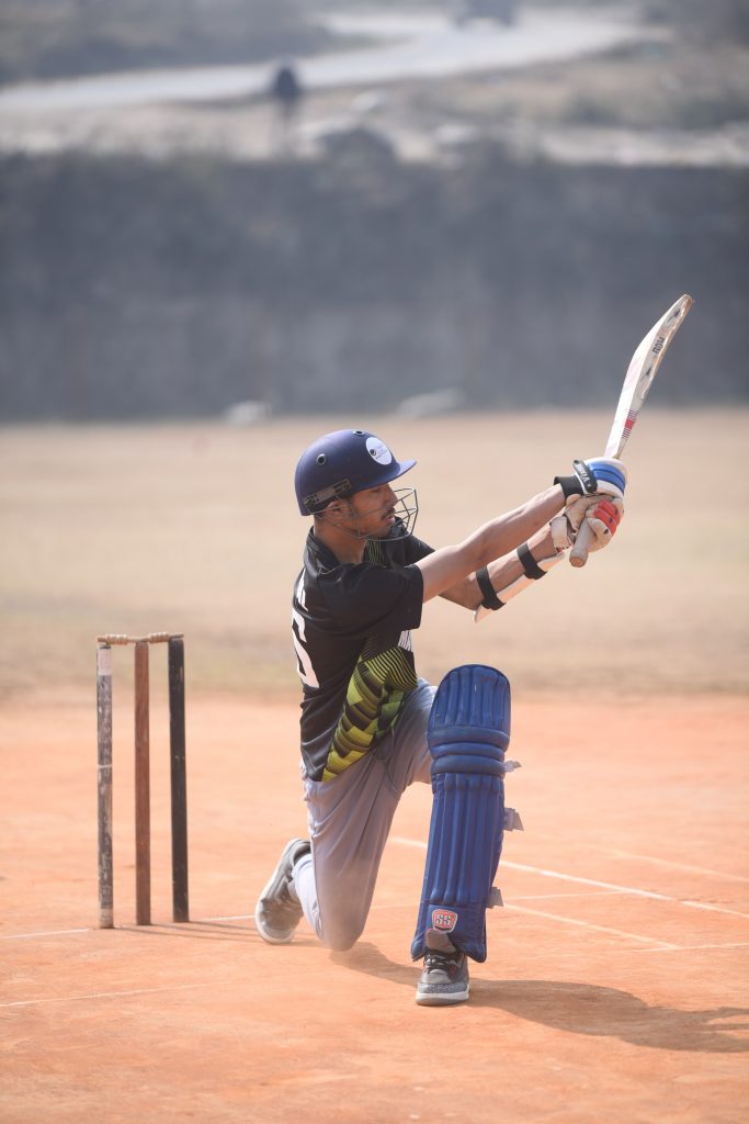 Uniglobe SS- Student with a bat playing cricket