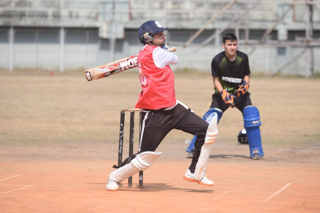 Uniglobe SS- Student playing Cricket